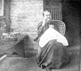 old lady on porch with sewing